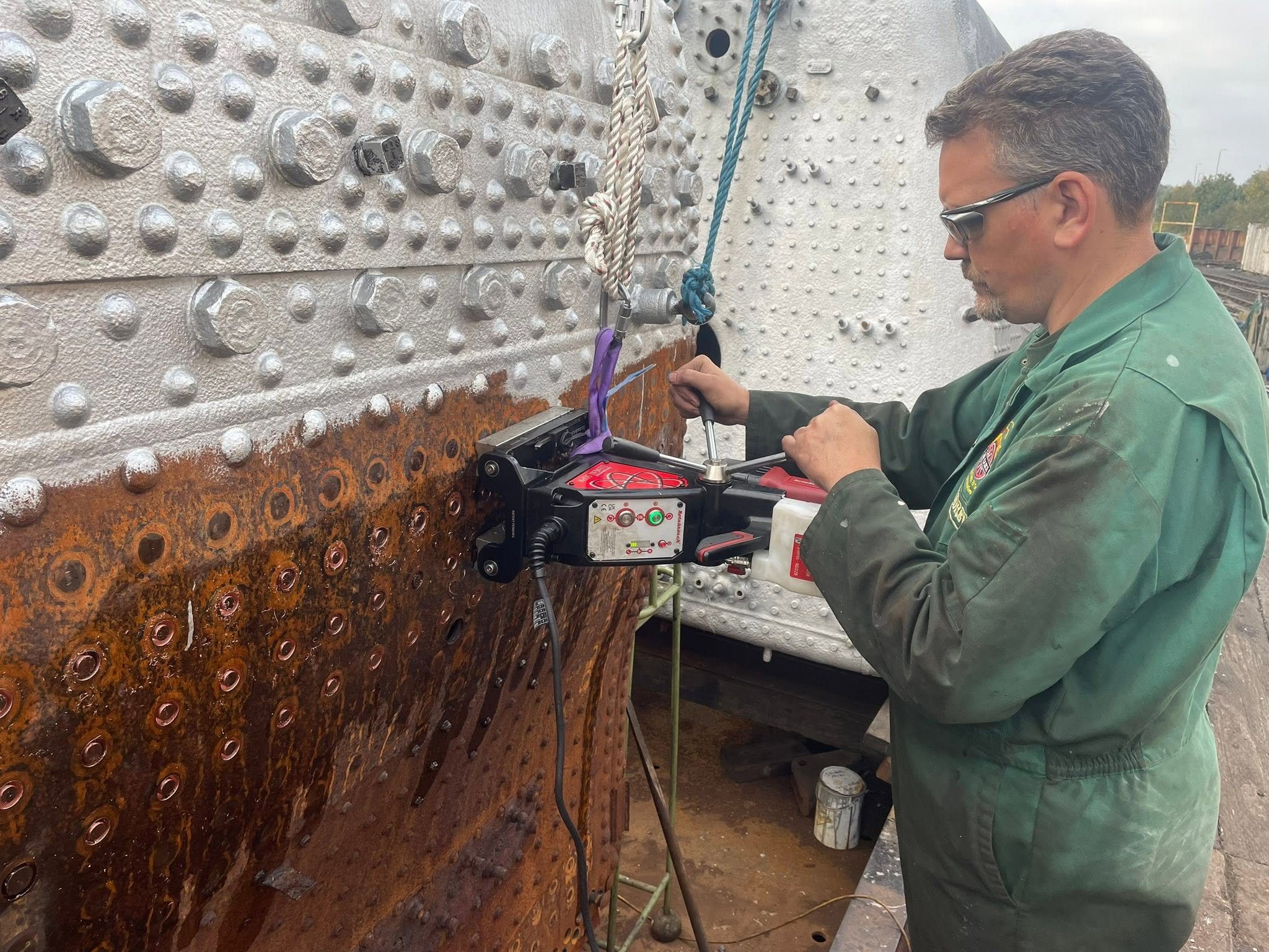 A Society volunteer drilling boiler stays during overhaul work